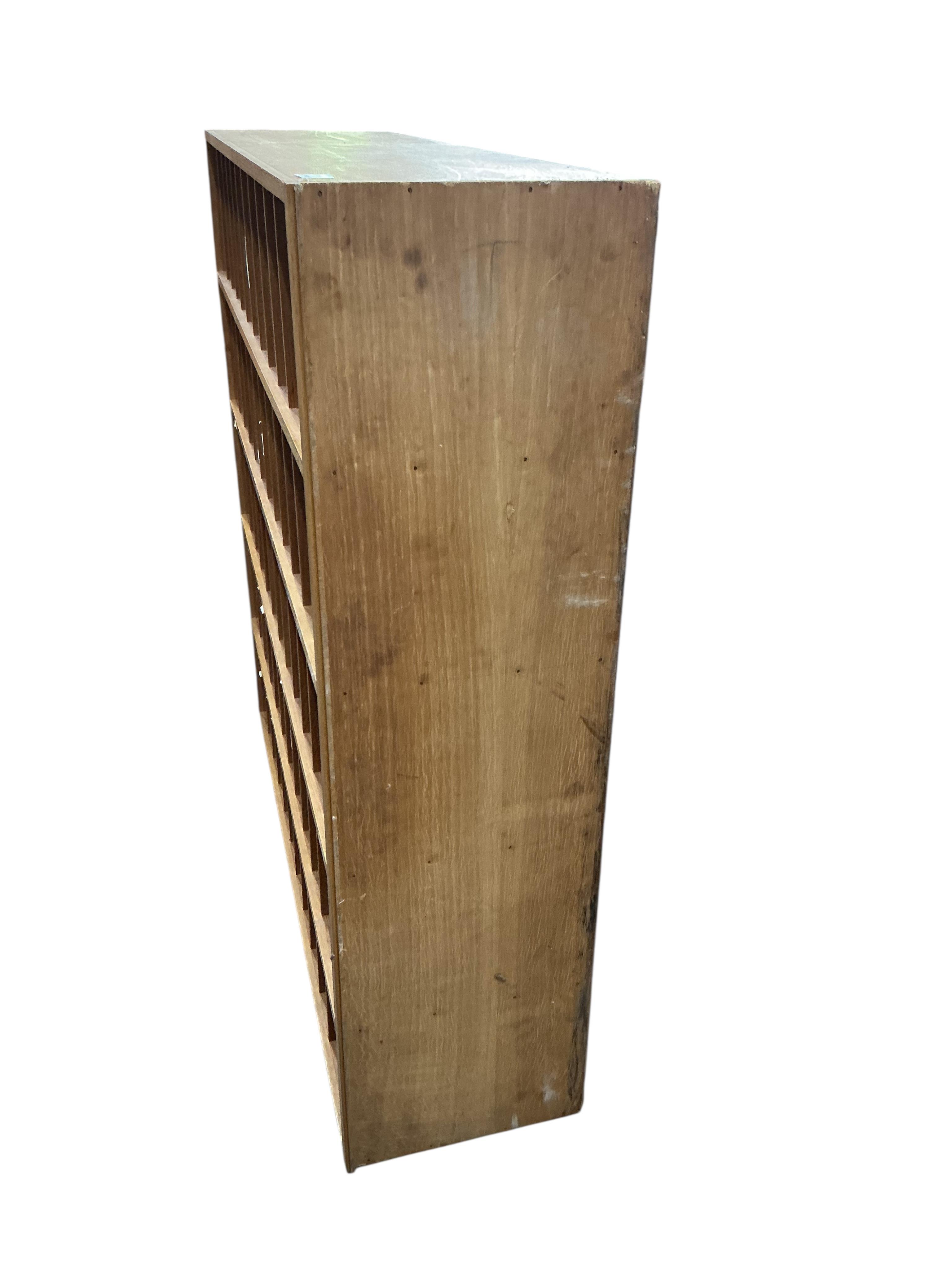 A mid century oak pigeonhole unit, width 122cm, depth 33cm, height 124cm